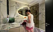 Long legs nerdy college girl with a short pink skirt and pink panties show off in the bathroom