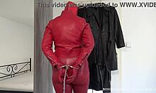 Red leather hooded wife in handcuffs and chains