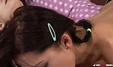 Two young lesbians in socks explore each other's bodies with tender touches and soft moans, building intense pleasure together