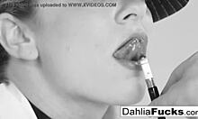 Dahlia Sky, a blonde teen pornstar, teases her pussy, tits, and ass in a solo scene