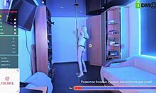 Blonde Alice dances on a pylon and spreads her tattooed legs