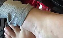 I try to catch my man's attention with my feet while he streams live, using toes and socks in a playful game.