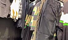 Blonde babe gives blowjob and handjob in clothing store, risking public exposure