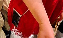 Blonde babe gives blowjob and handjob in clothing store, risking public exposure