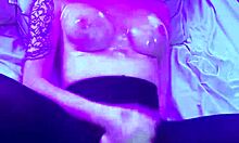 this tranny getting oiled up for anal on the bed with feet high in the air