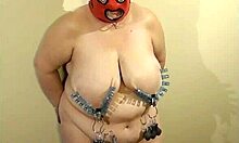 On January 14, 2016, Sklavin Esclave undergoes nipple weighting tests in part two of her bdsm session.