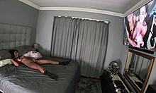 Desi masturbates with vibrator while watching herself getting fucked on tv, her tits bouncing.