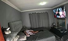 Desi masturbates with vibrator while watching herself getting fucked on tv, her tits bouncing.