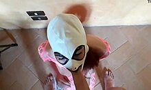 Masked petite teen in pink fishnet catsuit and platform boots gives rough pov blowjob to skinny guy
