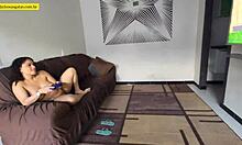 Young girl relaxes on couch with legs open