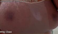 Watch my wife in the shower with her wet shirt and big tits?