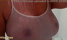 Watch my wife in the shower with her wet shirt and big tits?