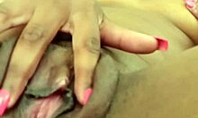 Ebony babe masturbates solo on mobile video