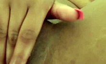 Ebony babe masturbates solo on mobile video