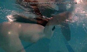 Natalia Kupalka, exquisite teen, swims naked in pool under water