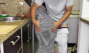 My stunning stepdaughter cleans the kitchen in a tight sexy dress. Her hot big ass keeps drawing my eyes.