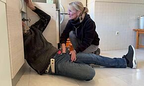 Hot wife sucks off the plumber right in the kitchen!