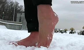 Hot Bitch Strolls Barefoot On Snow – Provocative!