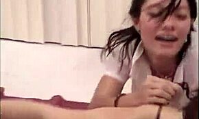 muscular guy grips two naughty schoolgirls on his lap