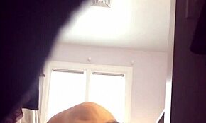 Check out this blonde milf in red panties showing her big tits on cam