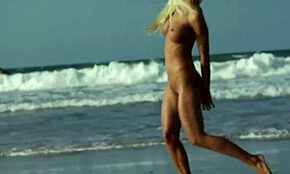 Stunning Blonde Posing Seductively on a Sandy Beach Shore