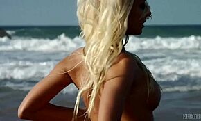 Stunning Blonde Posing Seductively on a Sandy Beach Shore