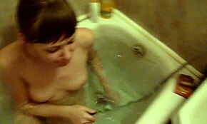 extremely happy chick brushing her teeth in the nude