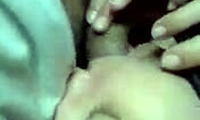 That dark-haired hottie is blowing cock while chatting on the phone.