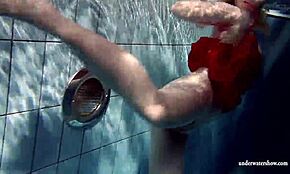 Russian teen lucie dives naked into underwater pool fun.