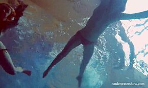 Marusia and Melisa Darkova dive into underwater bikini fun at pool.