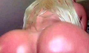 look at this blonde twerking her oiled huge tits and buttocks!