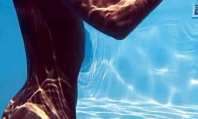 Hungarian blonde skinny pornstar swims naked at the pool.