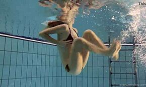 Nastya boldly strips naked on the beach in her bikini