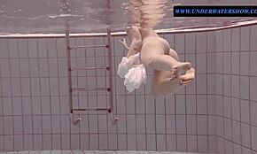 Tattooed teen Sara swims in clothes... so weird!