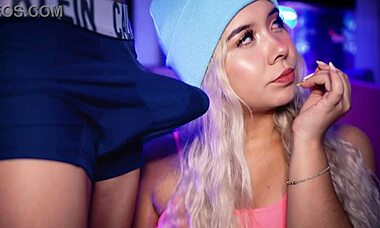 blonde college student with cute face playfully stimulates boyfriend over boxer shorts