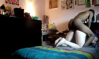 Skinny black guy drills his massive rod into a caucasian chick. Their bedroom session gets wild and steamy.