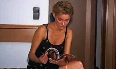 Hey, wanna see this tanned redhead take two huge cocks in a garage threesome?