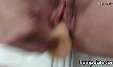 Hairy mature experiments with two toys in her pussy and squirts everywhere