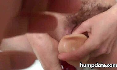 Hairy mature experiments with two toys in her pussy and squirts everywhere