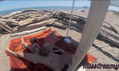 Exhibitionist teacher, wanna give a public handjob on nudity beach?