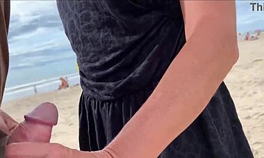I'm cumming right in front of everyone at the beach again. People are staring while I blow this huge cock with my tits out!