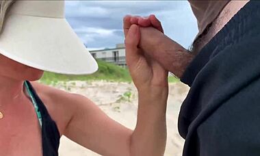 I'm cumming right in front of everyone at the beach again. People are staring while I blow this huge cock with my tits out!