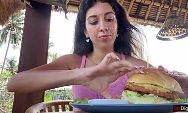 She asks, 'Want to see me eat a burger with cum on my face?'