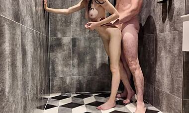 stepdaughter sneaks into the shower with her stepdad, getting wet and moaning as he explores her tight pussy