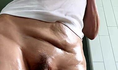 Mature Brunette Uses Baby Oil for Wet T-Shirt Striptease and Masturbation