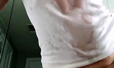 Mature Brunette Uses Baby Oil for Wet T-Shirt Striptease and Masturbation