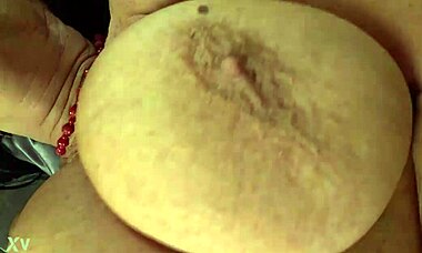 She pampers her saggy tits and self-fists to orgasm