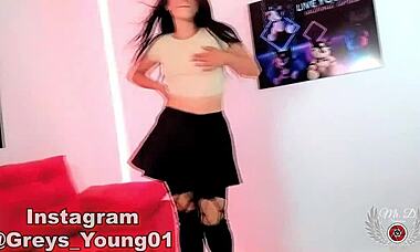 Cute 18-year-old schoolgirl in stockings dances for the camera